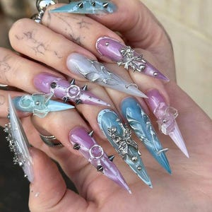 Edgy Fairy Punk Press On Nails, Y2K Fairycore Nail Art, Marble Spiked Press Ons, Faux Acrylic Nails, Pierced Pop Art Nails, Meverick Nails