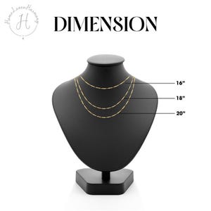 May include: Three gold-toned delicate chains displayed on a black neck form. The chains are labeled with lengths of 16 inches, 18 inches, and 20 inches. The text DIMENSION appears at the top, along with a logo featuring the letter H.