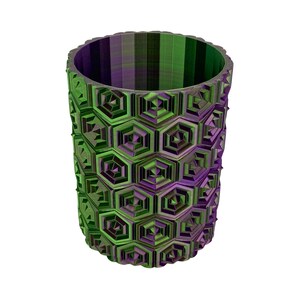 May include: A cylindrical vase with a geometric honeycomb pattern. The vase is primarily green and purple, with a textured surface. The design features repeating hexagonal shapes, creating a visually interesting and modern aesthetic.
