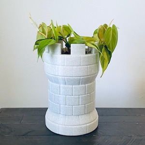 May include: A rustic wooden sign with the text "Welcome to our home" in white lettering. The sign features a distressed finish and a simple, inviting design, perfect for entryway decor.