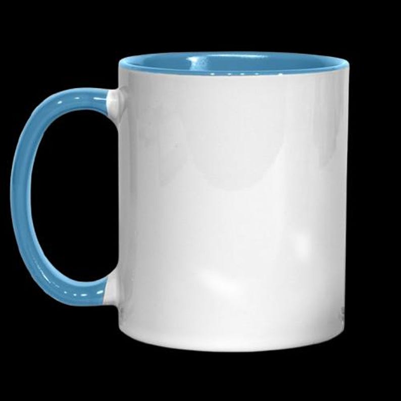 May include: A white ceramic mug with a light blue rim and handle. The mug is blank and ready to be personalized.