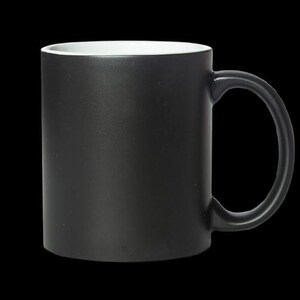 May include: A black ceramic coffee mug with a white interior. The mug has a rounded handle.