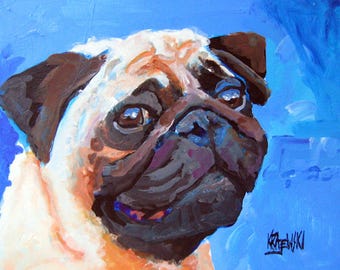 May include: An oil painting of a pug dog head with a fawn-colored coat and a dark brown muzzle against a vibrant blue background. The brushstrokes are visible and textured, capturing the dog's facial features. The artist's signature, Krajewski, is in the bottom right corner.