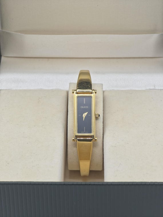 Gucci 0707/1500 15th Anniversary Gold Bangle Women's Swiss Watch