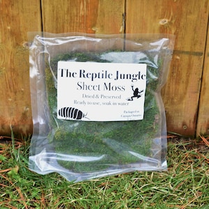 May include: A clear plastic bag containing dried and preserved sheet moss, labelled "The Reptile Jungle Sheet Moss". The label also states "Dried & Preserved, Ready to use, soak in water".