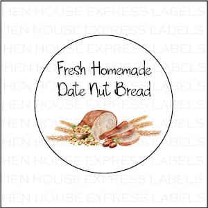 May include: A round white sticker with a black border. The sticker has a watercolor illustration of sliced date nut bread, wheat stalks, and a bowl of nuts. The text "Fresh Homemade Date Nut Bread" is written in black cursive font.