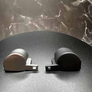The two color offerings for our Ergo Trigger Caps - Low Gloss Silver and Satin Black