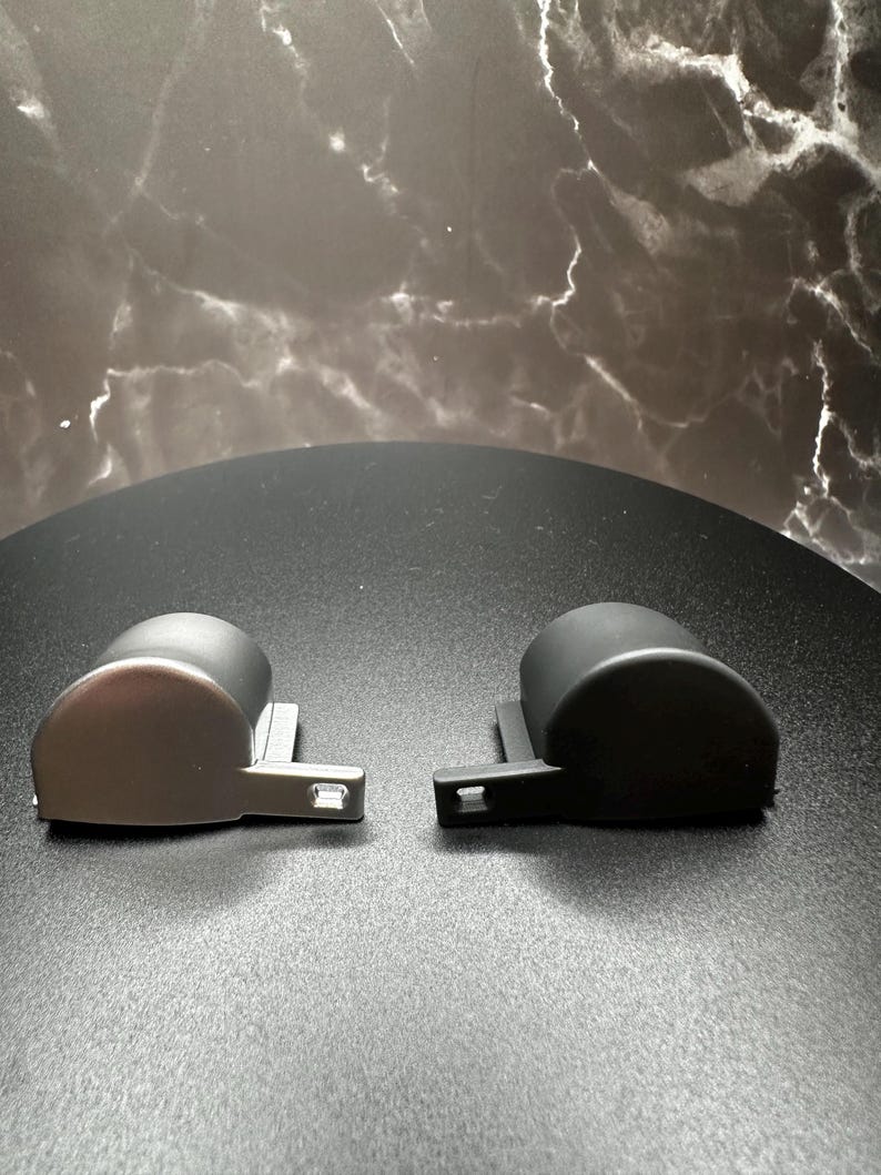 The two color offerings for our Ergo Trigger Caps - Low Gloss Silver and Satin Black