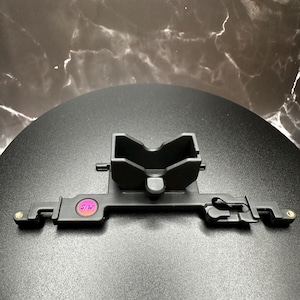 Our in house TrigKeys compatible rumble bracket (Color is matched to our Satin Black Ergo Trigger Caps)