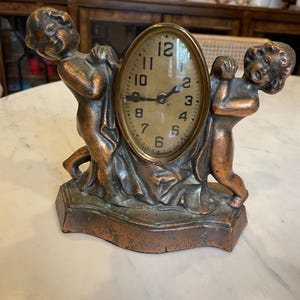 Antique Cherub Figural Mantle Clock