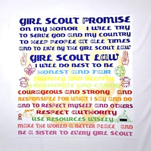 May include: A colorful Girl Scout Promise and Law poster with a white background. The text is in rainbow colors and includes the words "Girl Scout Promise", "Girl Scout Law", "Honest and Fair", "Friendly and Helpful", "Considerate and Caring", "Courageous and Strong", "Responsible for what I say and do", "Respect myself and others", "Respect Authority", "Use Resources Wisely", "Make the world a better place", and "Be a sister to every Girl Scout".