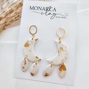 Eleganti orecchini pendenti a goccia grandi, orecchini glamour in oro, orecchini in cristallo con avvolgimento in filo metallico - Italia