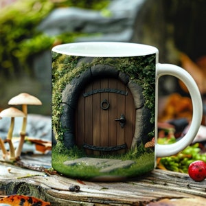 May include: White ceramic mug featuring a colourful image of a wooden door set within a stone archway, surrounded by green foliage. The mug is resting on a wooden surface with rocks and mushrooms.