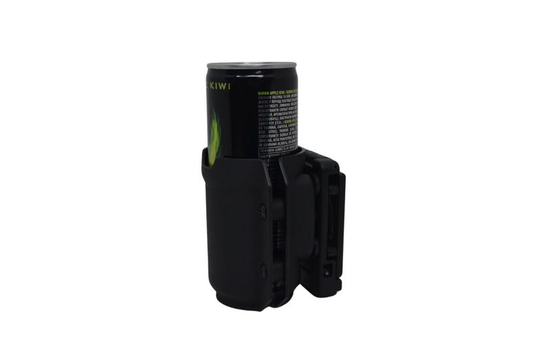 May include: A black can holder with a black can inside. The can has the word "KIWI" printed on it. The can holder has a clip on the side.