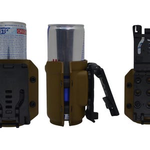 May include: Three views of a tan and black can holder. The holder is designed to secure a standard-sized beverage can. The holder has a black clip and a mounting system. The can in the holder has a white and blue label.