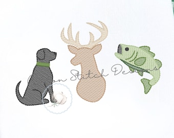 May include: A white fabric square featuring an embroidered design of a black dog with a green collar, a tan deer head with antlers, and a green fish. The embroidery is centered on the white material, which has a smooth, clean surface texture.