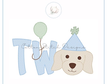 May include: Embroidered design featuring the word "TWO" in light blue, a green balloon, and a dog wearing a party hat. The dog has a brown nose and eyes. The text "Cotton Stitch Designs" is also present.