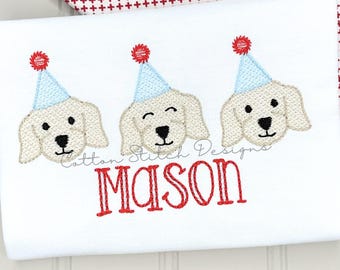 May include: White t-shirt with embroidered design featuring three smiling dog faces wearing light blue party hats with red pom-poms. The name "MASON" is embroidered in red below the dogs.