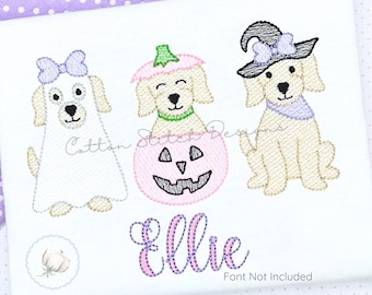 May include: Embroidered Halloween-themed design featuring three dogs dressed in costumes. One dog is a ghost, another is inside a pumpkin, and the third wears a witch hat. The name "Ellie" is embroidered below the dogs, with the text "Font Not Included".