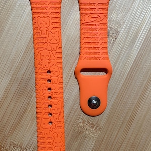 Ateez K pop themed engraved design on a silicone watch band compatible with Apple Watch and Samsung Galaxy Watch.
