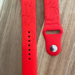 Move/Comic book themed. Red Hood engraved design on a silicone watch band compatible with Apple Watch and Samsung Galaxy Watch.