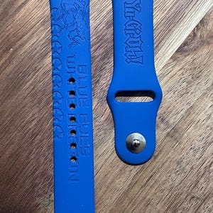 Anime themed engraved design on a silicone watch band compatible with Apple Watch and Samsung Galaxy Watch.