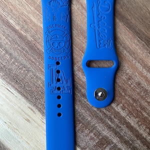 Anime and sports themed engraved design on a silicone watch band compatible with Apple Watch and Samsung Galaxy Watch.
