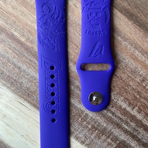 Anime and sports themed engraved design on a silicone watch band compatible with Apple Watch and Samsung Galaxy Watch.