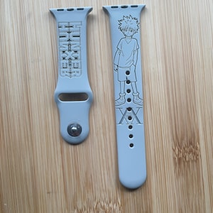 Anime Hunter Boy themed engraved design on a silicone watch band compatible with Apple Watch and Samsung Galaxy Watch.
