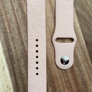 Cute little monsters themed engraved design on a silicone watch band compatible with Apple Watch and Samsung Galaxy Watch.