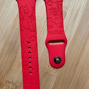 Anime Fire character themed engraved design on a silicone watch band compatible with Apple Watch and Samsung Galaxy Watch.