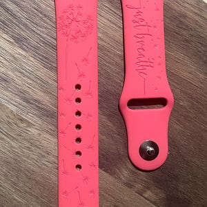 Just breathe engraved design on a silicone watch band compatible with Apple Watch and Samsung Galaxy Watch.