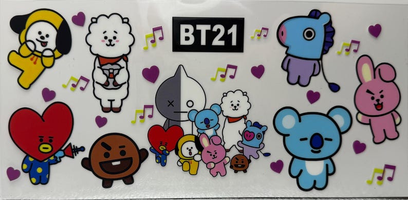 May include: A sheet of stickers featuring BT21 characters. The stickers include cartoon figures in various colours, such as yellow, white, red, and blue. Musical notes and purple hearts are scattered around the characters.