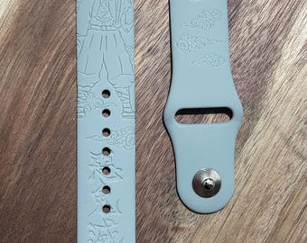 Anime themed engraved design on a silicone watch band compatible with Apple Watch and Samsung Galaxy Watch.