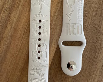 Taylor S’ album compilation themed engraved design on a silicone watch band compatible with Apple Watch and Samsung Galaxy Watch.