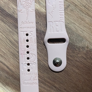 Custom engraved design on a silicone watch band compatible with Apple Watch and Samsung Galaxy Watch.