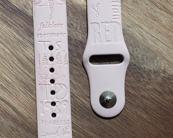 Taylor S’ album compilation themed engraved design on a silicone watch band compatible with Apple Watch and Samsung Galaxy Watch.