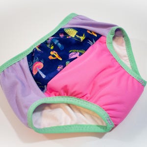 May include: A set of three ceramic mugs with a speckled, matte finish. The mugs are in shades of cream, light gray, and dark gray. Each mug has a simple, minimalist design, perfect for coffee or tea.