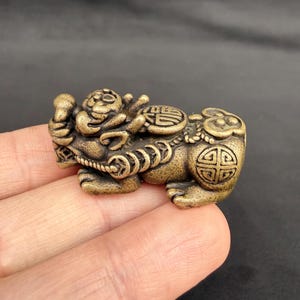 May include: A handmade wooden sign with the text "Welcome to our home" in a handwritten style. The sign is painted white with black lettering and a distressed finish. It is rectangular and suitable for indoor or outdoor use.