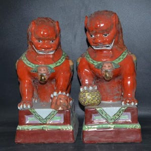 Antique Chinese Red Glazed Foo Dogs: Porcelain Guardian Lion Statues