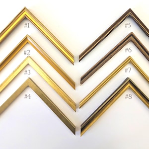 May include: Eight different picture frame corner samples, each with a unique design and finish. The frames are numbered from #1 to #8, showcasing various gold and brown tones. The image is taken on a white background.