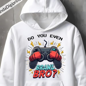 May include: White hoodie with a graphic of a video game controller wearing boxing gloves. The text on the graphic reads "Do you even brawl bro?"