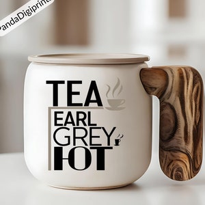May include: White ceramic mug with a wooden handle. The mug has black text that reads "TEA EARL GREY HOT" with a small teacup icon next to the word "TEA" and another teacup icon next to the word "HOT".