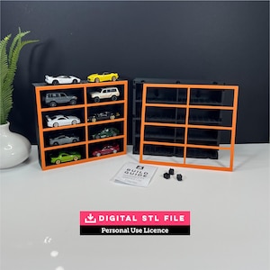 May include: A modular display rack for 1:64 scale diecast cars, featuring a black frame with bright orange trim. The set includes two rack units, one with eight toy cars, a separate orange frame, a printed build guide, and small black connectors.