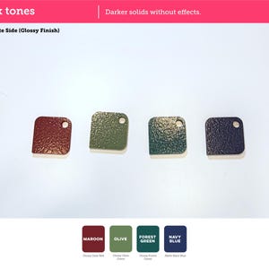 May include: Four square-shaped material swatches with rounded corners and a single hole in the top right corner. The colors are maroon, olive, forest green, and navy blue. The text reads Dark tones, Build Plate Side (Glossy Finish), Maroon, Olive, Forest Green, and Navy Blue.