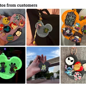 May include: A collection of Mickey Mouse-shaped pin display boards in various colors including pink, grey, orange, glow-in-the-dark green, and black. Each board features a grid of holes for attaching metal enamel pins of various shapes and designs.