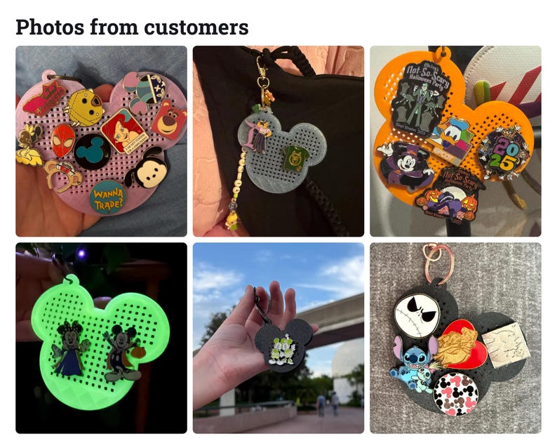 May include: A collection of Mickey Mouse-shaped pin display boards in various colors including pink, grey, orange, glow-in-the-dark green, and black. Each board features a grid of holes for attaching metal enamel pins of various shapes and designs.