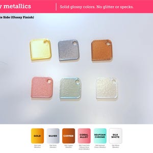 May include: Six square-shaped metallic swatches with rounded corners and a hole in the top right corner. The colors include gold, silver, copper, coral, seafoam green, and white. Text reads: Silky metallics, Solid glossy colors. No glitter or specks, Build Plate Side (Glossy Finish), GOLD, SILVER, COPPER, CORAL ALLOY, SEAFOAM CHROME, SILK WHITE.