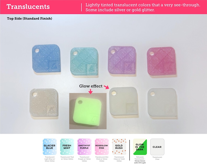 May include: A collection of seven square translucent plastic swatches with rounded corners and a hole in one corner. Colors include light blue, teal, purple, pink, clear with glitter, and a square showing a green glow-in-the-dark effect.