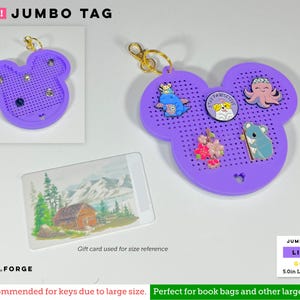 May include: A lilac, Mickey-shaped pegboard display tag with a gold-toned keyring. The tag features a grid of small holes for enamel pins, including a blue dragon, a dog with the text Stay Pawsitive, a pink octopus, flowers, and a koala.